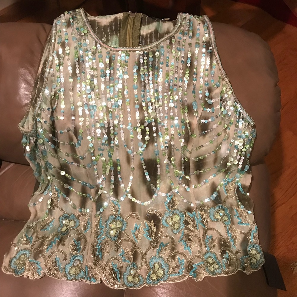 Green/turquoise sleeveless sequined top.